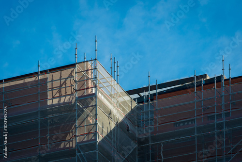 Scaffold sheeting net wrapped apartments building during insulation in england uk