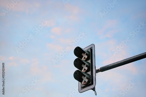 A non-functioning traffic light. Ampel. Symbolic off or stop with XXX symbolism