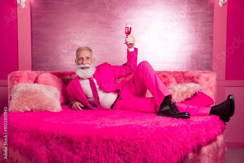 Photo of mature grandfather boyfriend lying feel flirt raise wine glass wear blazer boots in pink color room interior