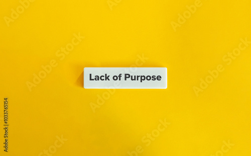 Lack of Purpose. Text on Block Letter Tile on Yellow Background. Minimal Aesthetic.