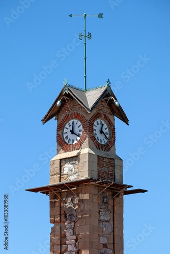 Clock tower in Lavrio port , Greece.. Sunny day with blue sky. It was built around 1870 -1880