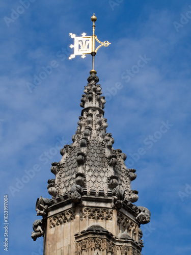 London/UK - July 08 2017: Golden crest on the top of one of Westminster Palace towers. The Palace of Westminster is the meeting place of the House of Commons and the House of Lords