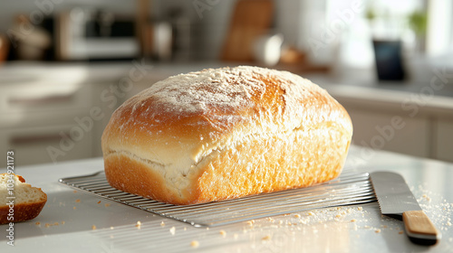 Freshly baked bread in top of table with slicer