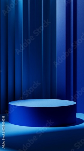 Elegant blue cylindrical podium against a backdrop of deep blue curtains, creating a luxurious and mysterious atmosphere for product display or presentations.