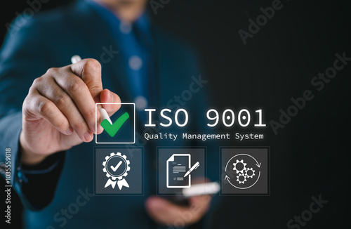 QMS, ISO 9001 Quality Management System concept. Certified and quality management of organizations Businessman using smartphone to choose ISO 9001 on virtual screen.