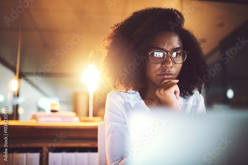 Black woman, thinking and night with laptop or glasses for business decision or project deadline at office. Young African, female person or employee working late in wonder or contemplating choice