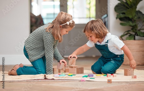 Playing, children and wooden blocks in house, fun and bonding of family, growth and development in lounge. Games, kids and learning with toys, siblings and together in living room, floor and home