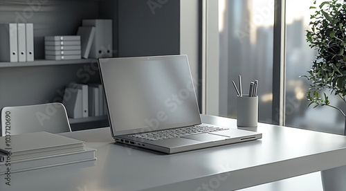 A gray office table with a state-of-the-art laptop, some property regularization office objects.