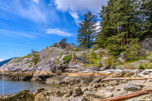 Fantastic view over ocean, snow mountain and rocks at Sechelt inlet in Vancouver, Canada.