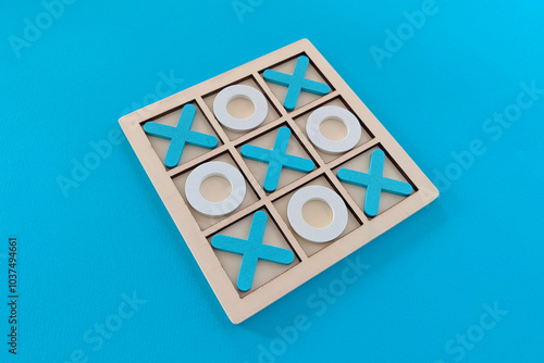 Tic tac toe game set on blue background