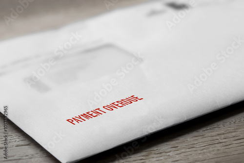 Payment overdue letter stamped in red on an envelope. Cost of living debt concept