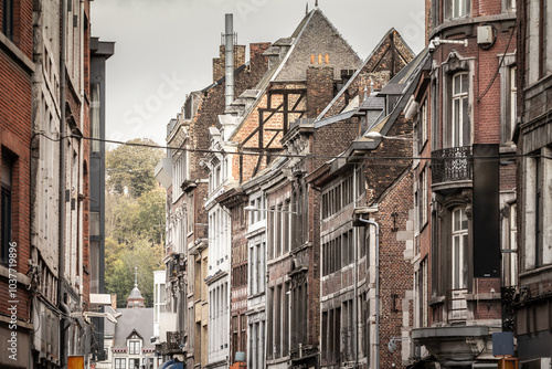 Selective blur on Rue Surlet, a narrow street of the city center of Liege, with facades of old buildings with medieval style, in a typical Wallonia belgian style.