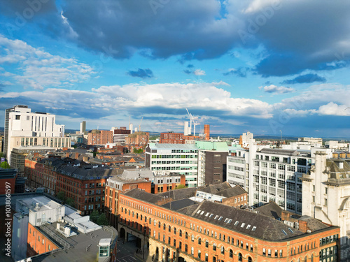 Aerial View of Greater Manchester City Centre and Tall Buildings During Golden Hour of Sunset. England UK. May 5th, 2024, High Angle Footage Was Captured with Drone's Camera