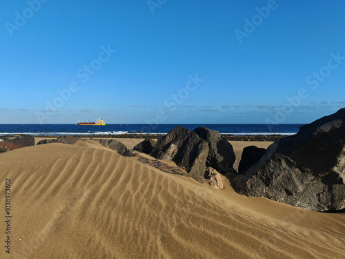 Sand dunes and rocks on the Atlantic coast of Lanzarote, Spain