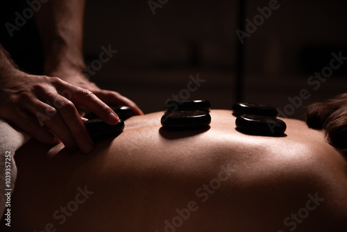 hot stone massage, spa treatment, relaxation, wellness therapy, body care, back massage, holistic healing, professional massage, health spa, stress relief, hot stones, luxury spa, body therapy