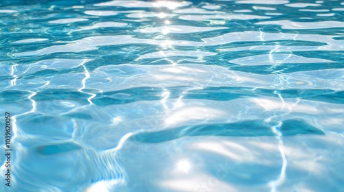  A crystal-clear swimming pool filled with blue water reflects the sun at its surface A white frisbee floats undisturbed in the pool's center