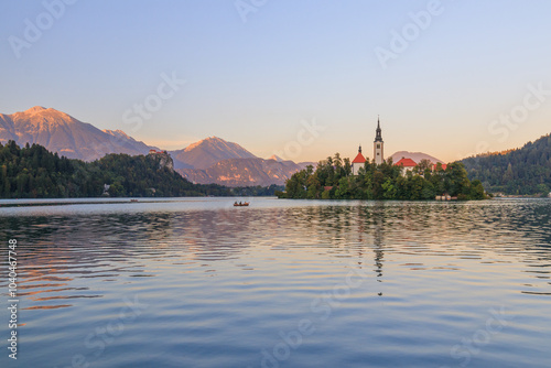 Lake bled in the slovenian alps slovenia during sunset with warm golden light golden hour