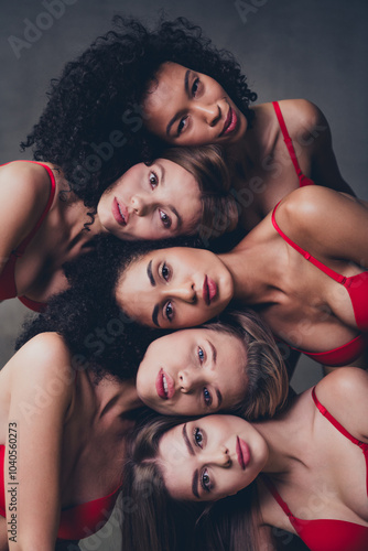 No retouch photo of lovely cute different nationalities ladies together on gray concrete wall background in studio