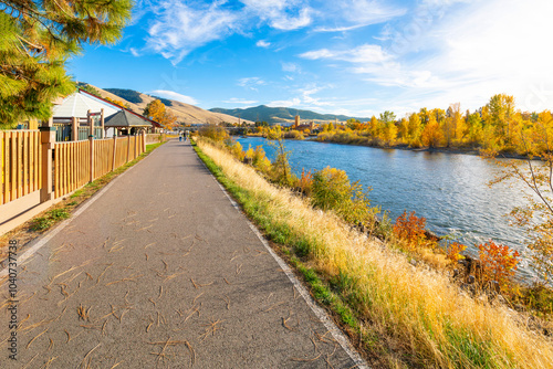 View from the Riverfront Trail along the Clark Fork River of the University District and tower of the Boone Crockett Club Natural History Museum in downtown Missoula, Montana.