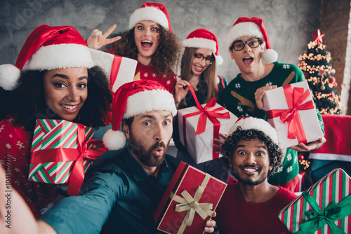 Portrait of group friends colleagues selfie giftbox v-sign christmas party loft office indoors