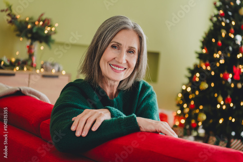 Photo of pretty lovely woman wearing green knitted clothes christmas event cozy atmosphere indoors home