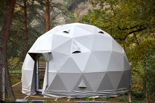 Geodesic dome is a hemispherical thin-shell structure lattice shell based on geodesic polyhedron. Glamping is of glamorous and camping, style of camping with amenities and resort style services.