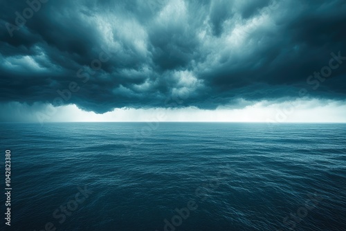 Dramatic cloudscape gathering over dark blue ocean water