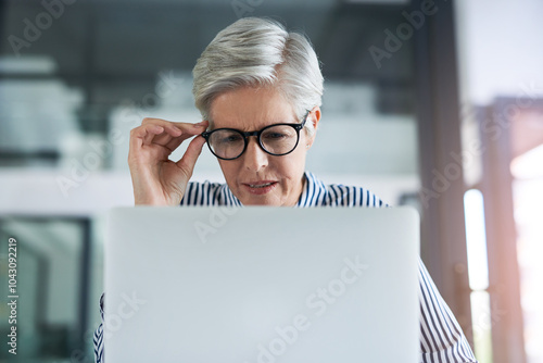 Mature woman, laptop and stress in office, 404 error and manager with glasses for eyesight difficulty. Female person, taxes mistake and website glitch at accounting firm, frustrated and finance fail