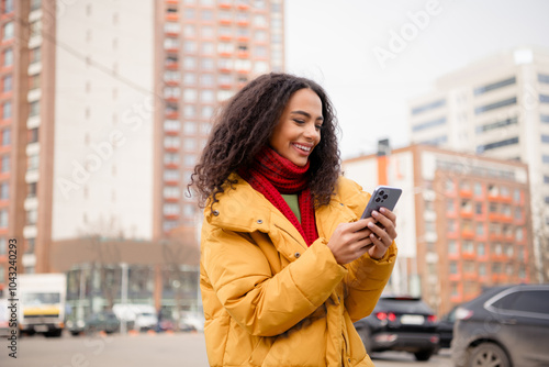 Photo of cheerful cute girl wear stylish jacket walk downtown city center weekend autumn day outdoors outside