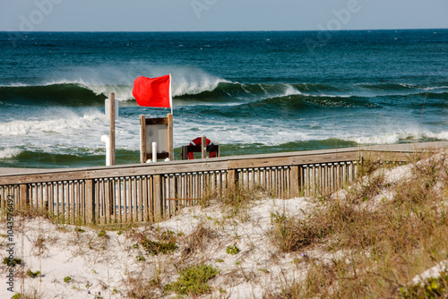 Red flag warnings fly along north Florida gulf beaches at Topsail Hill Preserve State Park, Santa Rosa Beach, Florida