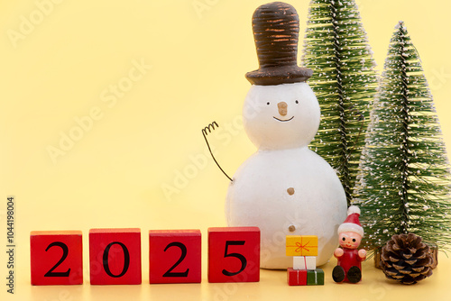 Merry christmas and happy new year decorated with old snowman and others on yellow background.