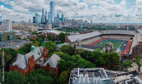 Stadium, buildings and the city skyline at the University of Pennsylvania, Philadelphia, Pennsylvania, United States.