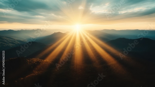 Bright sunrise beams pierce the sky, illuminating a vast and majestic mountain landscape, full of hope and renewal, embodying the splendor of creation.