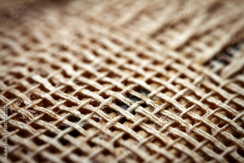 Extreme closeup of an old book from the side. Selective soft focus, shallow depth of field. Bibliophile, bookworm abstract background. Book binding detail.