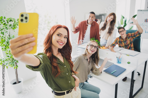 Photo of happy smiling students waving hello enjoying business school studying recording video device indoors workplace workstation