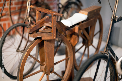 wooden toy for kids called draisin from the 40s. running toy, scooter and bicycle concept.