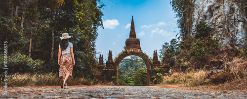 Traveler asian woman relax and travel in temple at Khao Na Nai Luang Dharma Park Surat Thani Thailand