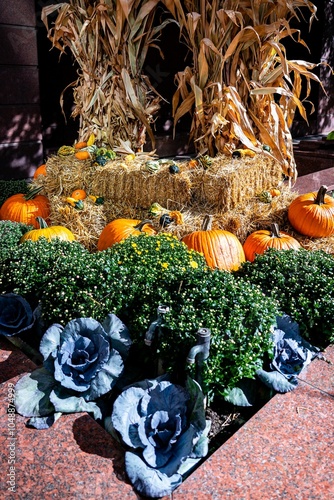 Autumn Harvest Display with Pumpkins and Hay Bales