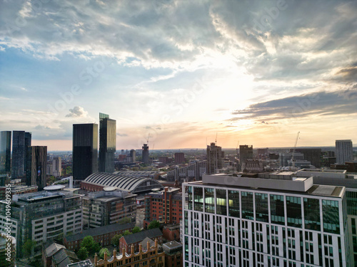 Aerial View of Greater Manchester City Centre and Tall Buildings During Golden Hour of Sunset, England UK. High Angle View Was Captured with Drone's Camera on the day of May 5th, 2024