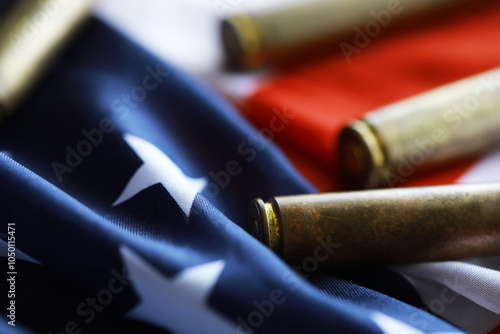 Many bullets cartridges and medals on United States flag. Concept of war glory victory. Gun trafficking on special operations