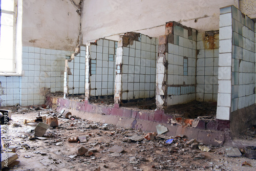 a ruined room, a public toilet. destruction, abandoned premises. partitions between toilets. Mental Hospital Bathroom. old abandoned premises, ruin. empty territories, abandoned houses