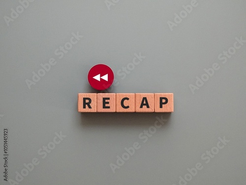 wooden cube with the word Recap and back arrow. flashback concept. business finance