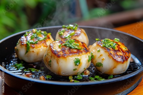 Mushrooms sautÃ©ing in a pan with garlic and herbs, steam rising and the texture of each mushroom cap visible