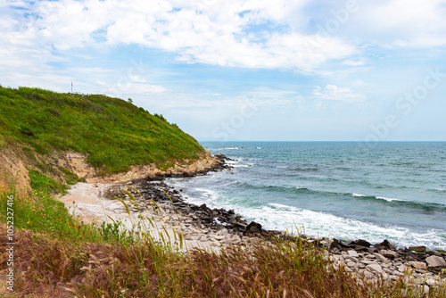 Scenic view with a stony wild beach at the Bulgarian Black Sea coast near the Cape Akra Fortress near Chernomorets, Province of Burgas