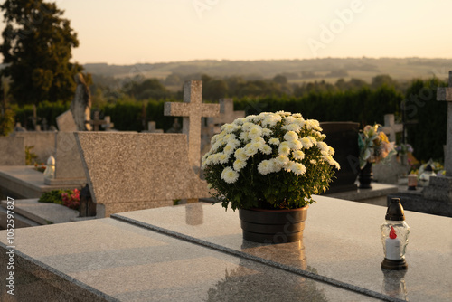 Flowers decoration on the grave on All Saints' Day