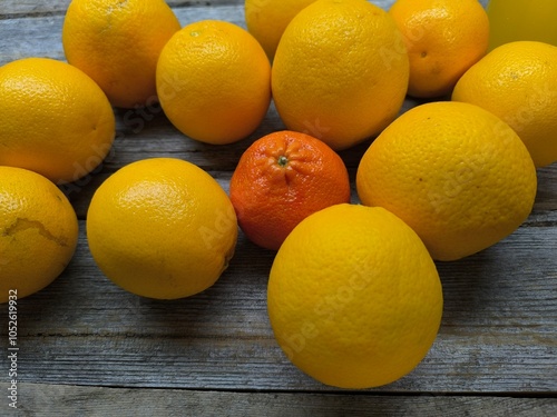 juicy oranges on a wooden table.