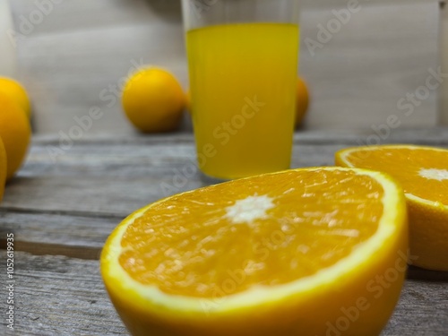 juicy oranges on a wooden table.