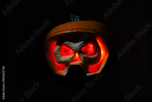 Creepy Halloween Pumpkin Skull with an orange glow