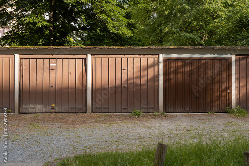 DDR Garage units in a row in East Germany. Exterior of the front of the building with the doors closed. Those small spaces are often available for rent to park the car or as storage.