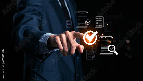 Businessman makes a checklist Assessment and questionnaire, businessman using tablet to do online survey online digital form Show green check mark Choose the correct answer on the exam.